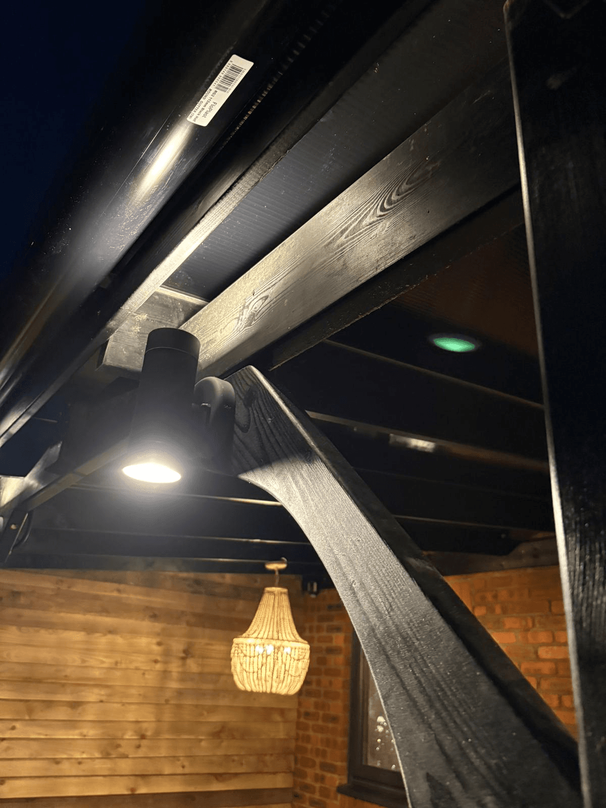Close-up of garden room ceiling lighting with pendant and spotlights