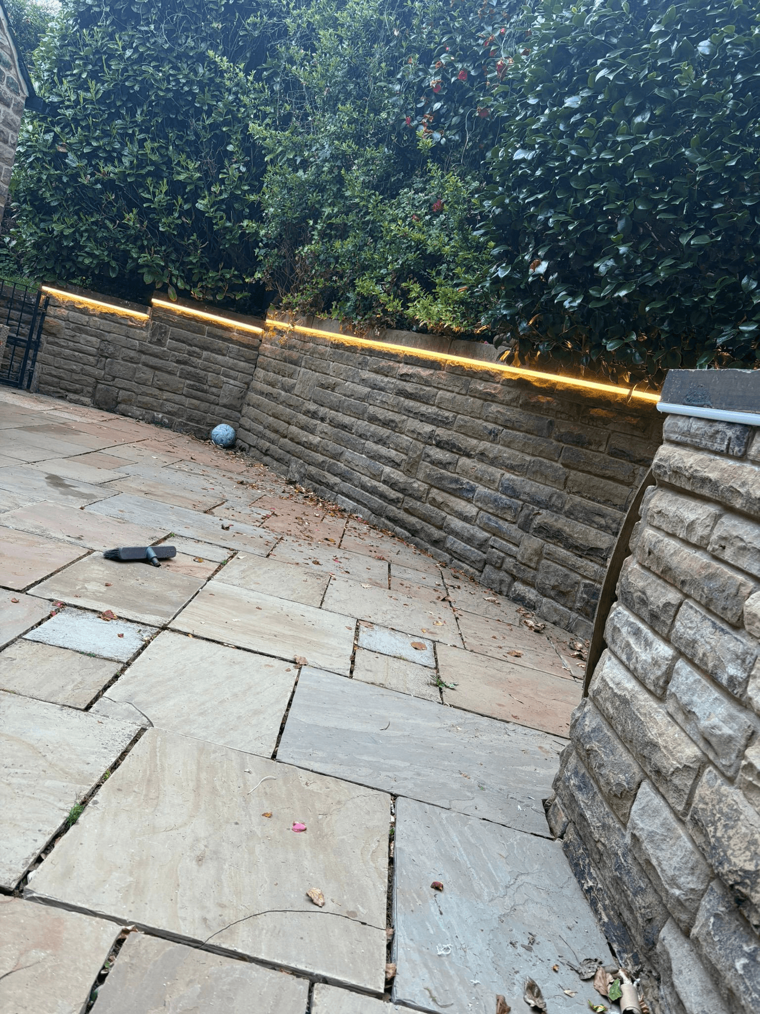 LED strip lighting along top of garden wall